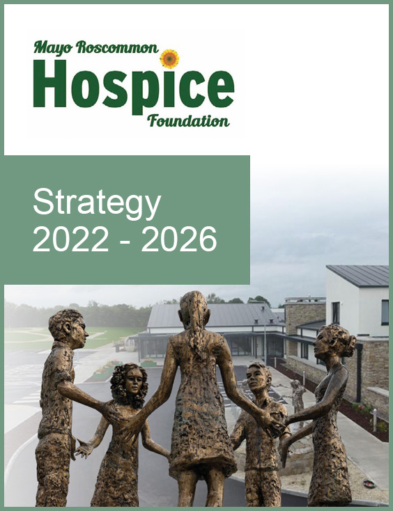 Bronze statues of six people holding hands in a circle outside a modern building, symbolising unity and support, with text reading Mayo Roscommon Hospice Foundation Strategy 2022-2026 at the top.