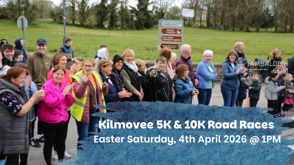 A crowd of people, including children, cheer and clap near a road. Overlaid text advertises the Kilmovee 5K & 10K Road Races in support of the Mayo Roscommon Hospice on Easter Saturday, 4th April 2026 at 1pm. Trees and a road sign are in the background.