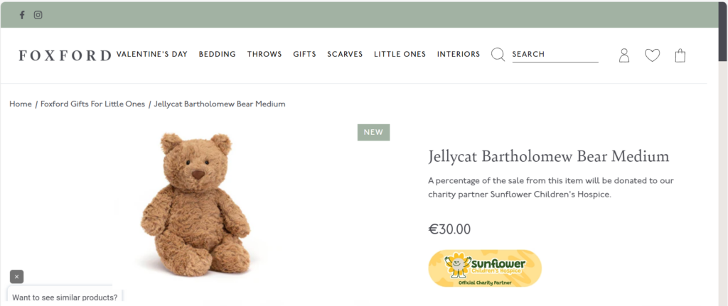 A medium-sized Jellycat Bartholomew Bear soft toy is featured on a retail website. Price listed is €30.00, with a note that part of the sale supports Sunflower Children’s Hospice and Mayo Roscommon Hospice.