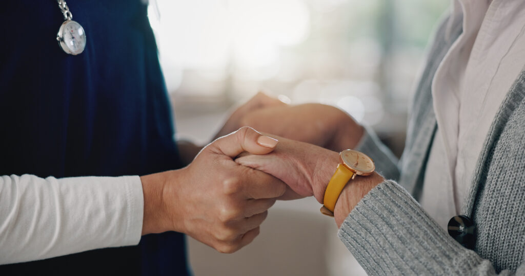 People, healthcare and holding hands with nurse in support for consultation, empathy and kindness. .